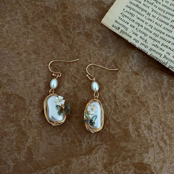 E001: Butterfly,flower and pearl earrings